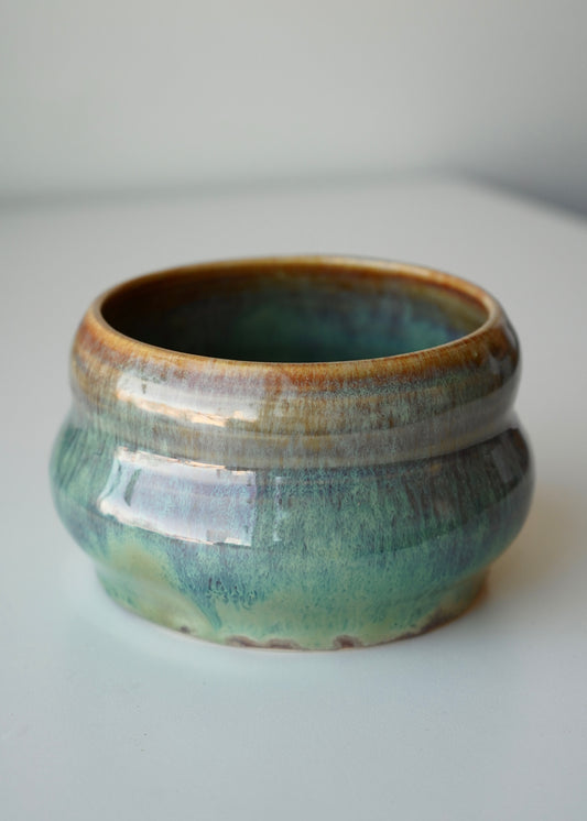 green, blue, and brown galaxy bubble planter