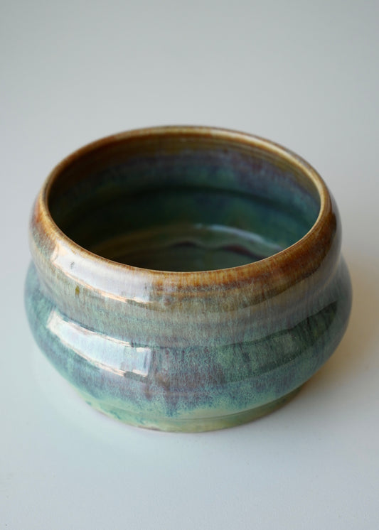 green, blue, and brown galaxy bubble planter